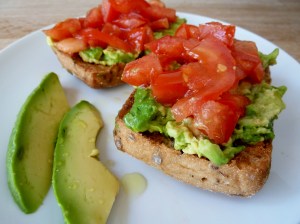 Toasted GF Schar roll with mashed avocado and chopped tomato